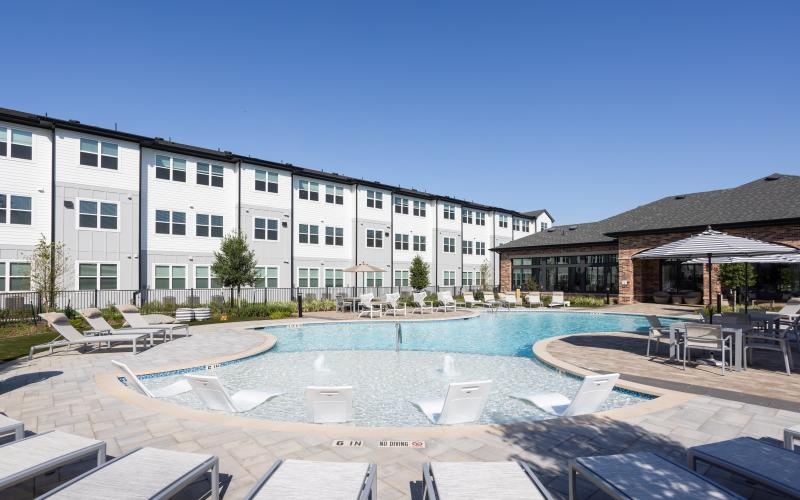 pool with ample seating surrounding it