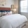 a bed with a flower on the wall