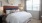 a bed with a flower on the wall