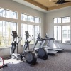 fitness area with treadmills and ceiling lighting
