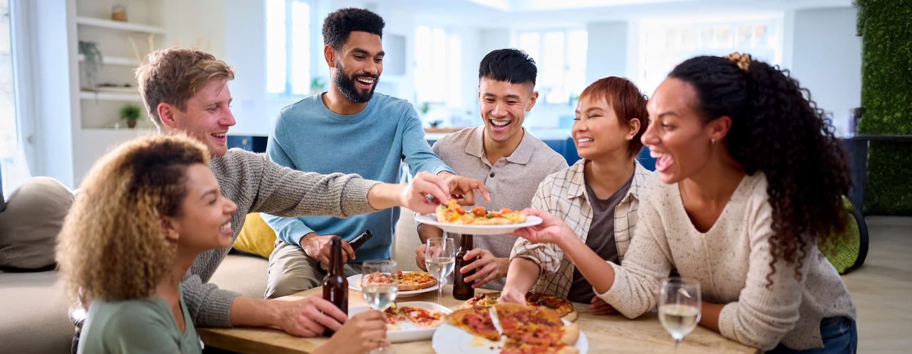 a group of people sharing food indoors