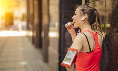 Entertainment and Recreational a woman outdoors with running gear on her arm
