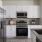 a kitchen with white cabinets