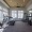 fitness center with open spaces and bright lighting through the windows