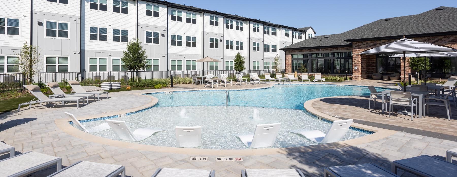 pool with ample seating surrounding it
