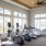 a room with exercise equipment and windows